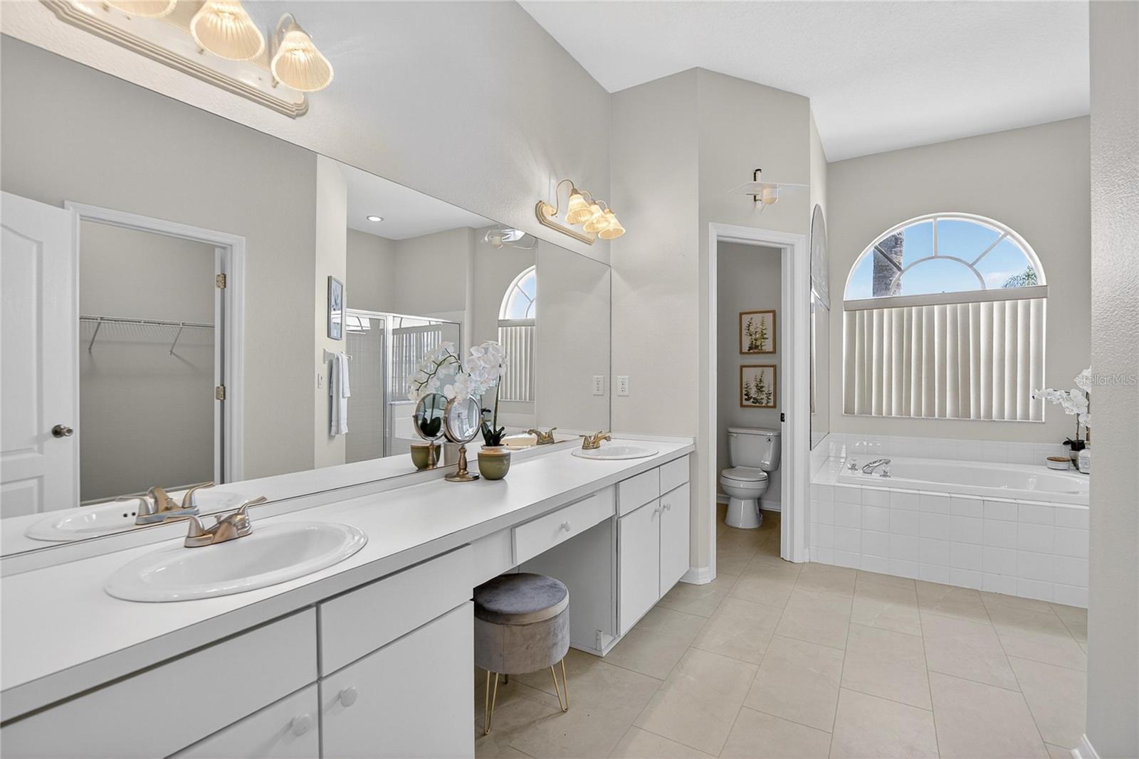 Primary bath has a garden tub, separate water closet and duel sinks