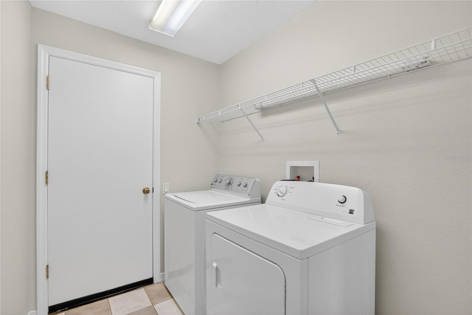 Indoor laundry room with washer and dryer