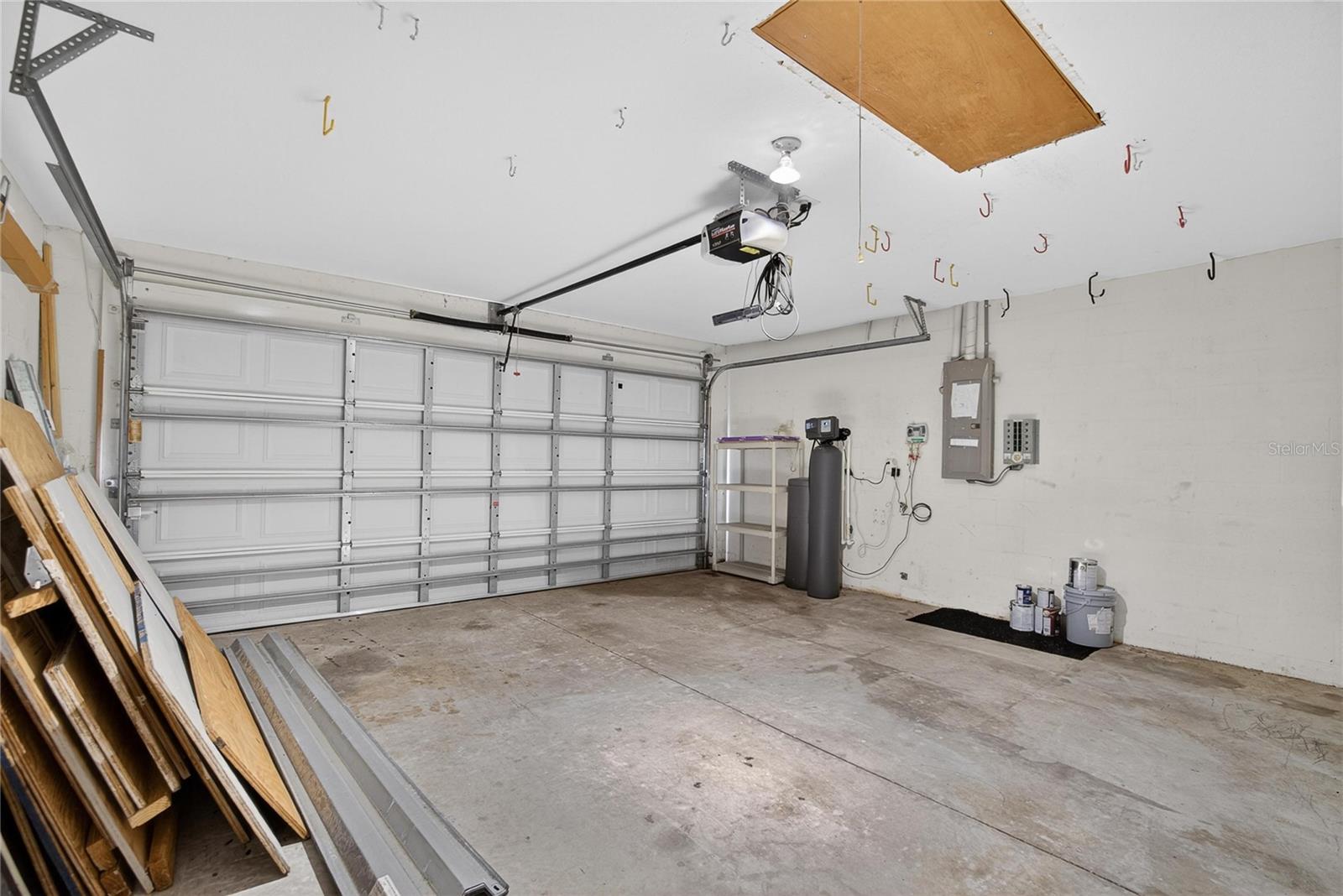 Garage has hurricane shutters, water softener and extra refridgerator