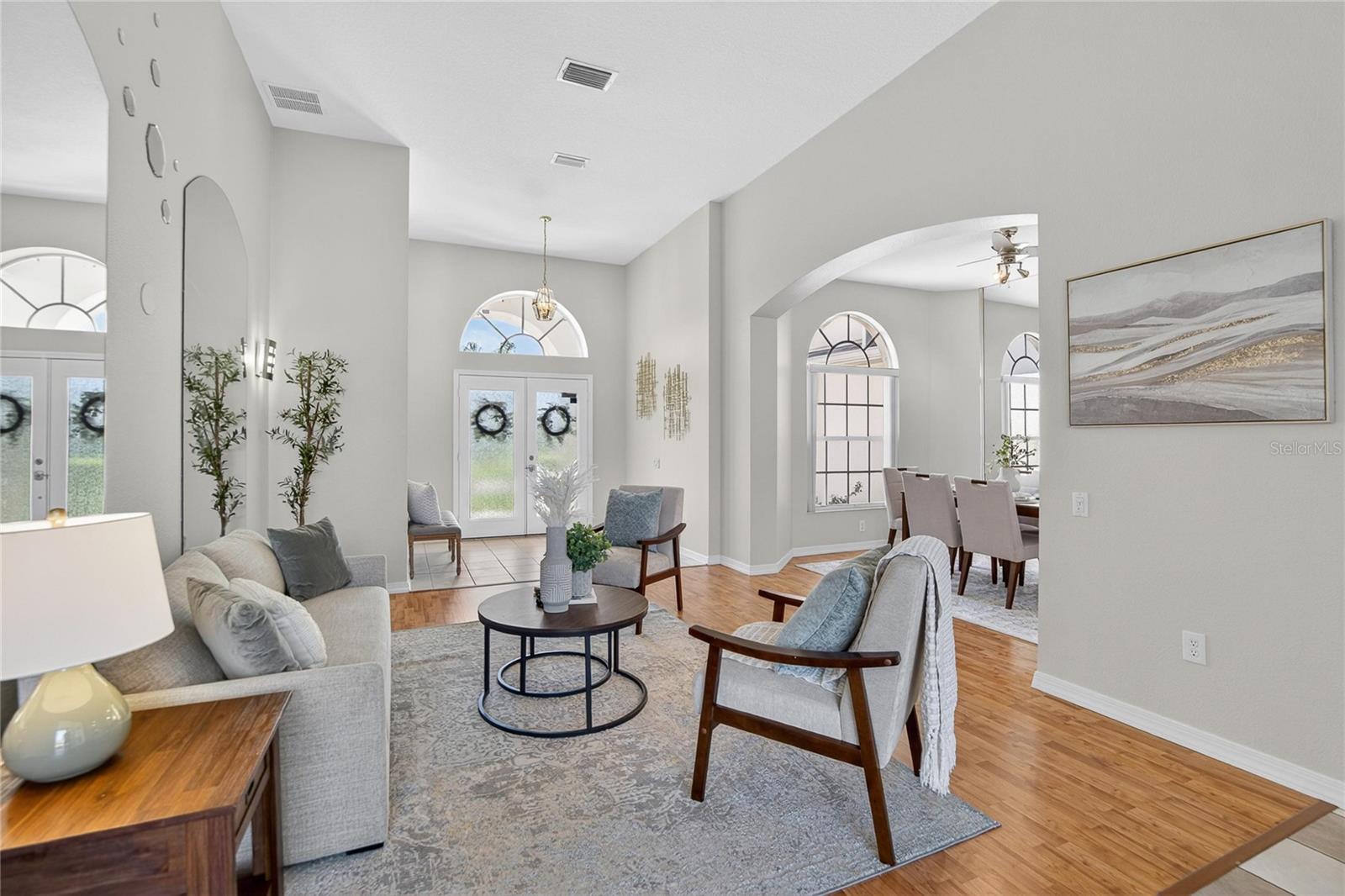 The living room connects to a formal dining room