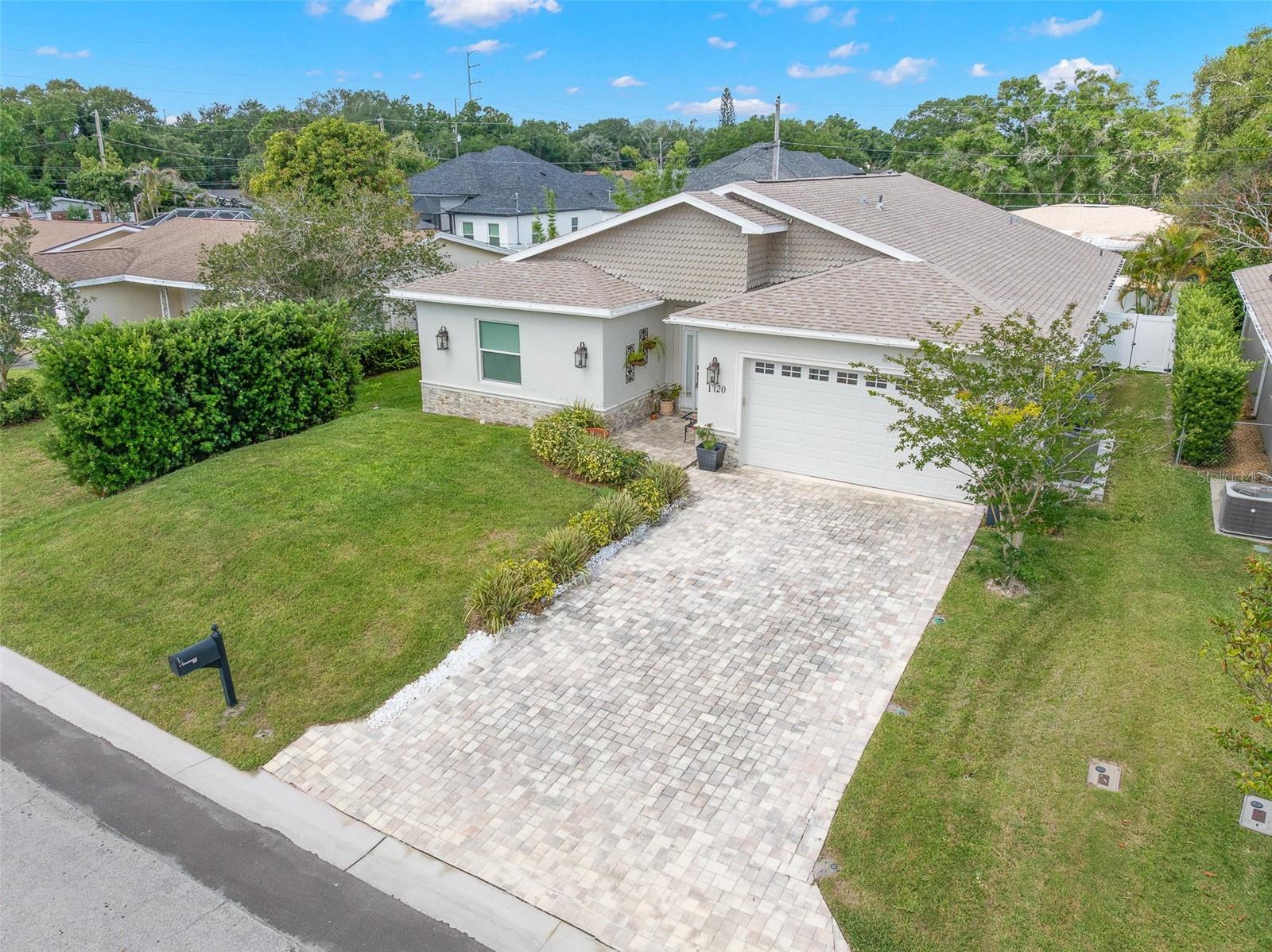 Neutral exterior tones, dimensional rooflines, and upgraded finishes create standout curb appeal just minutes from Countryside, Dunedin, and Gulf beaches.
