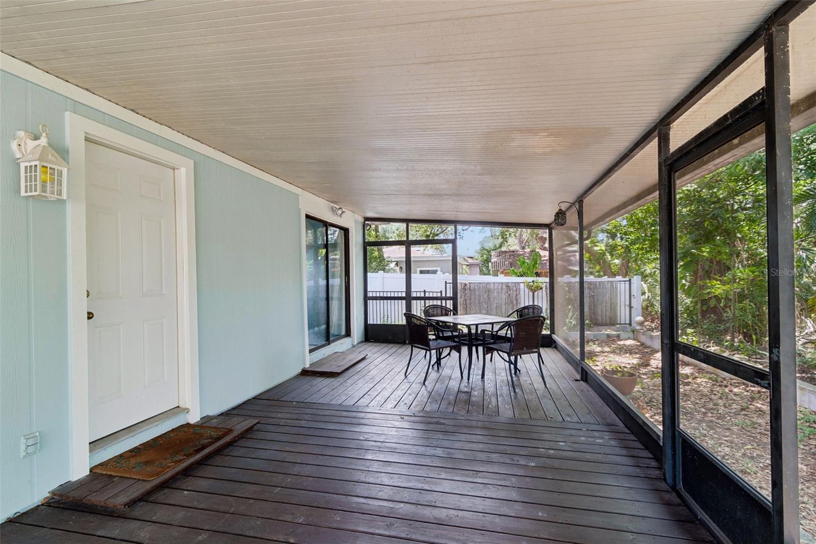 Lanai has access from the kitchen and guest bedroom.