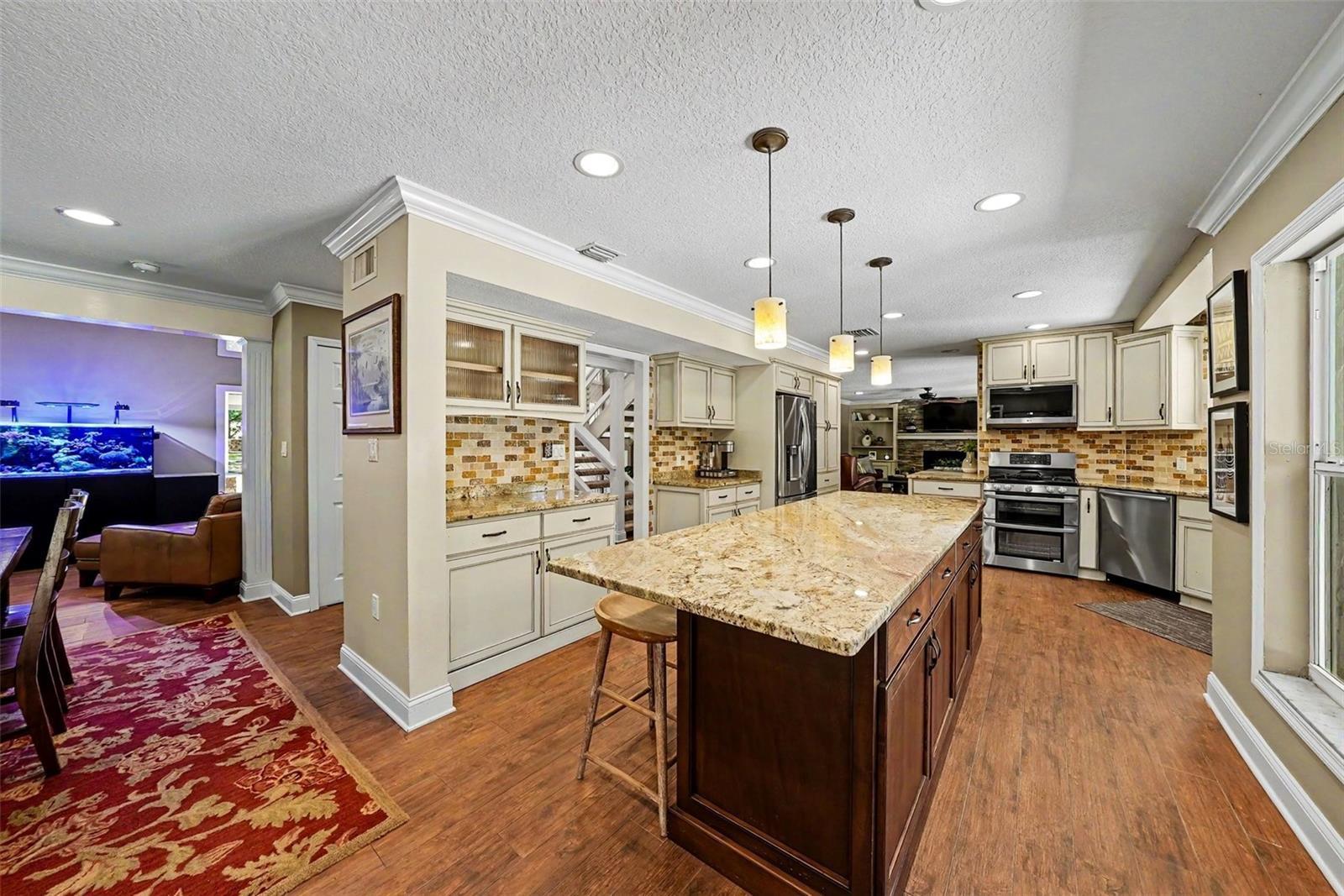 Endless granite island welcome the best gathering spaces!