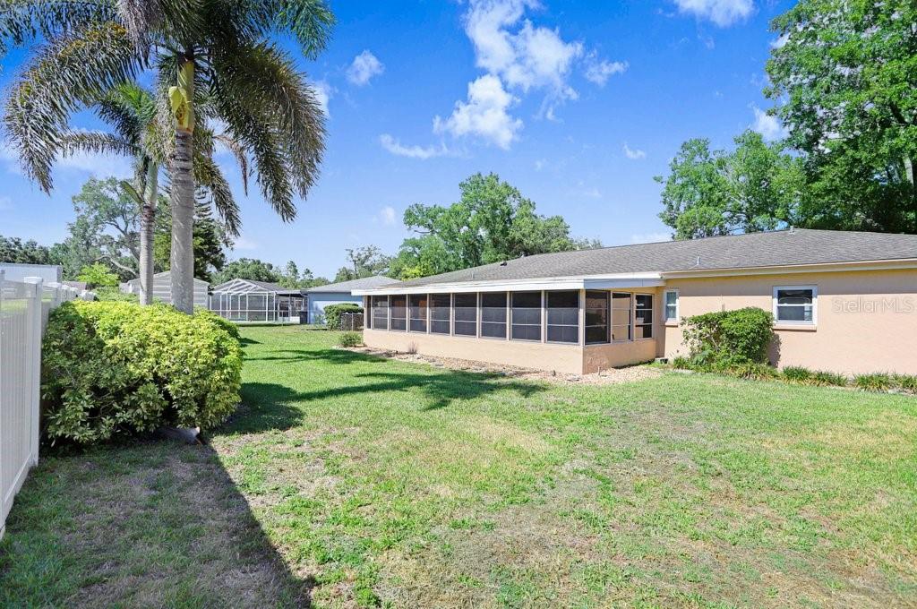 View of back yard and back of home