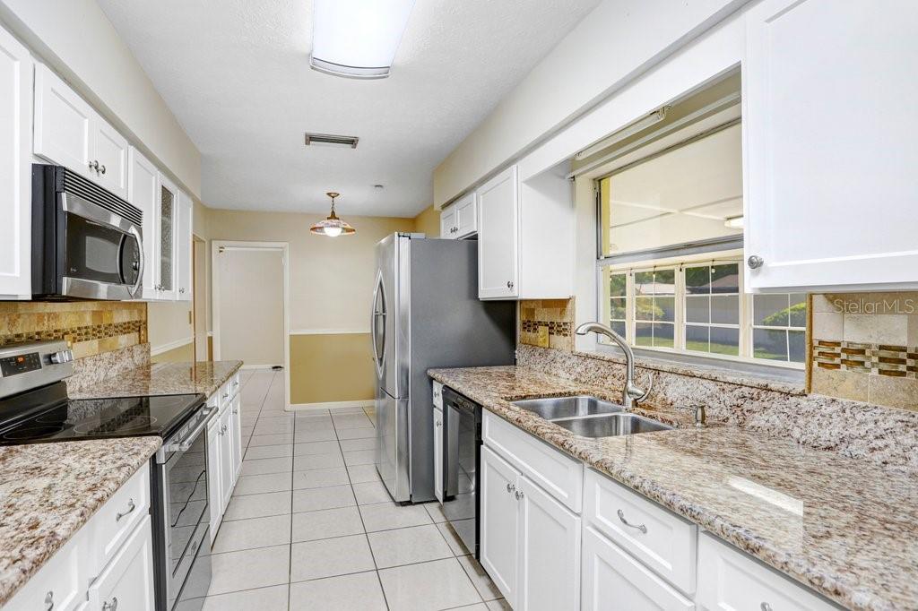 Kitchen with granite countertops and stainless appliances
