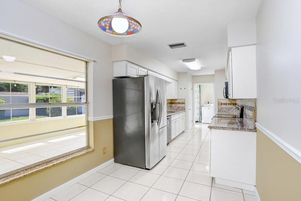 Kitchen with granite countertops and stainless appliances