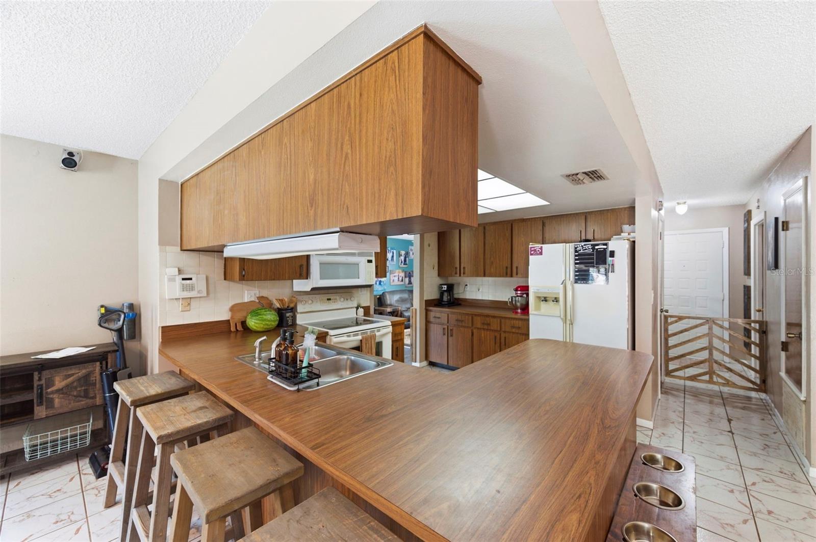 Custom gat in the background between Kitchen and Foyer.