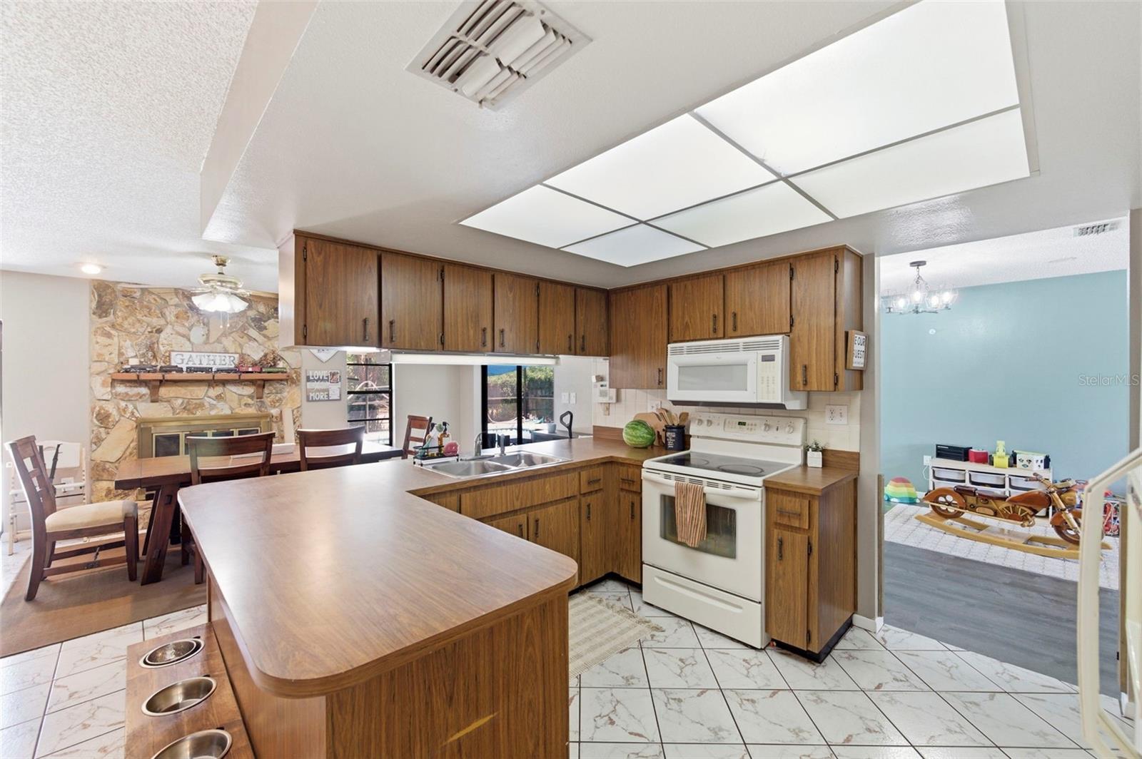 Kitchen with eat-in space, opens to Family Room and Dining Room.