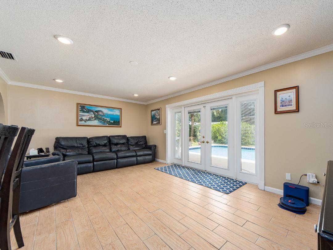 FAMILY ROOM THAT OVERLOOKS THE POOL