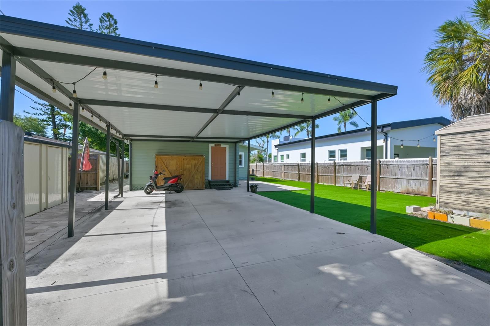 Gated Backyard Parking off Alley w/ Carport