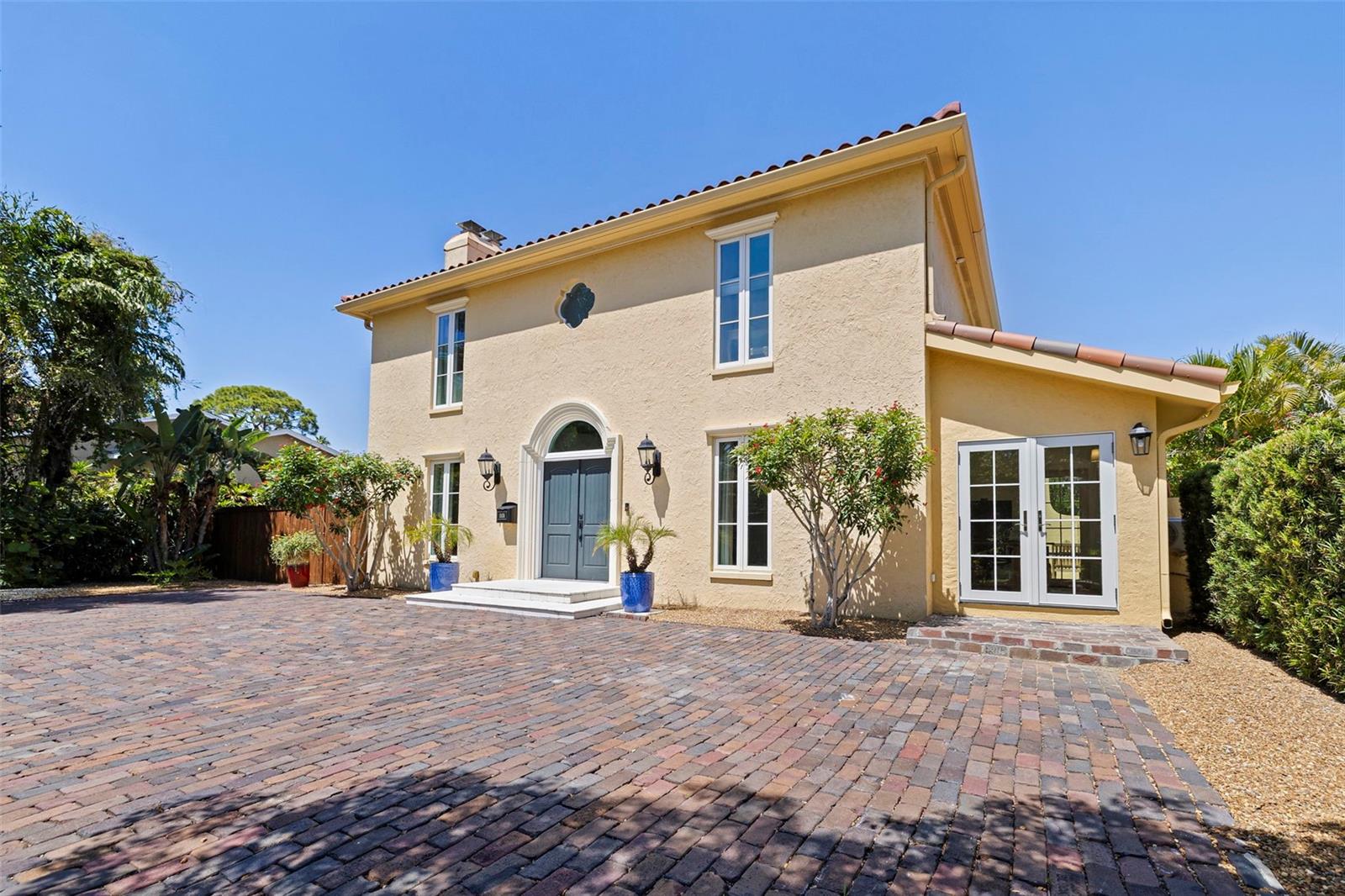 Historic Salvage: Tudeen utilized original bricks salvaged from the historicstreets of St. Petersburg for the motor court, grounding the modern structure inlocal history.