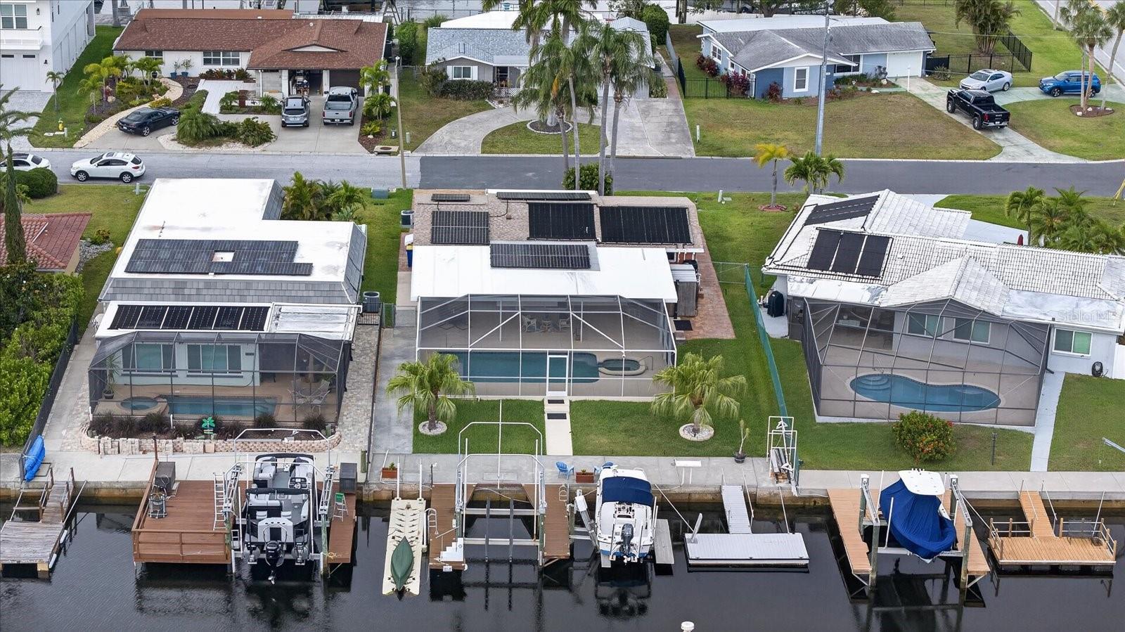 Aerial of home with pool and boat lift