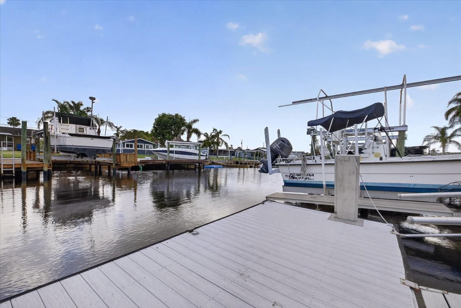 Dock and boat lift on deep gulf channel