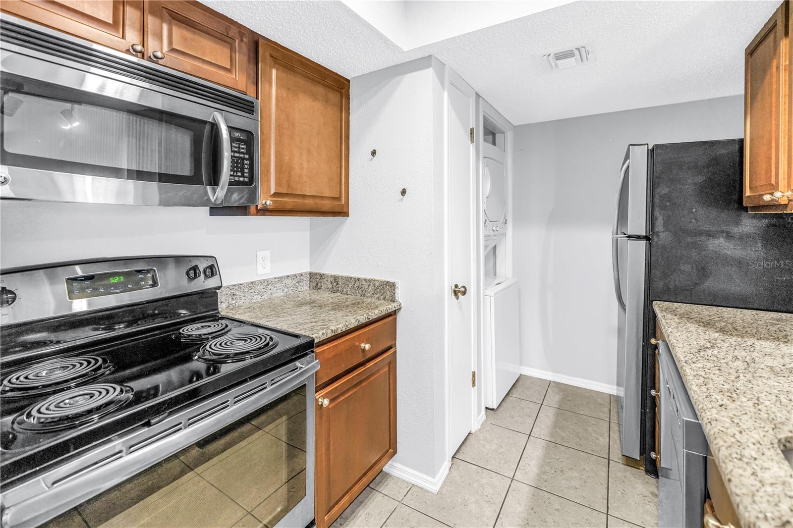 Kitchen Features Stainless Appliances and Granite Counters