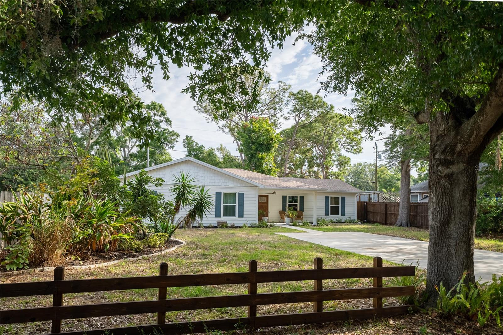 Large driveway with plenty of off-street parking in front of home