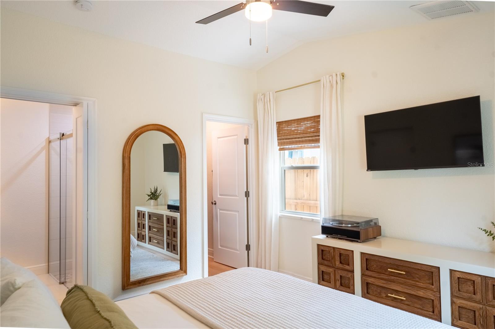 Walk-in closet and en-suite in primary bedroom