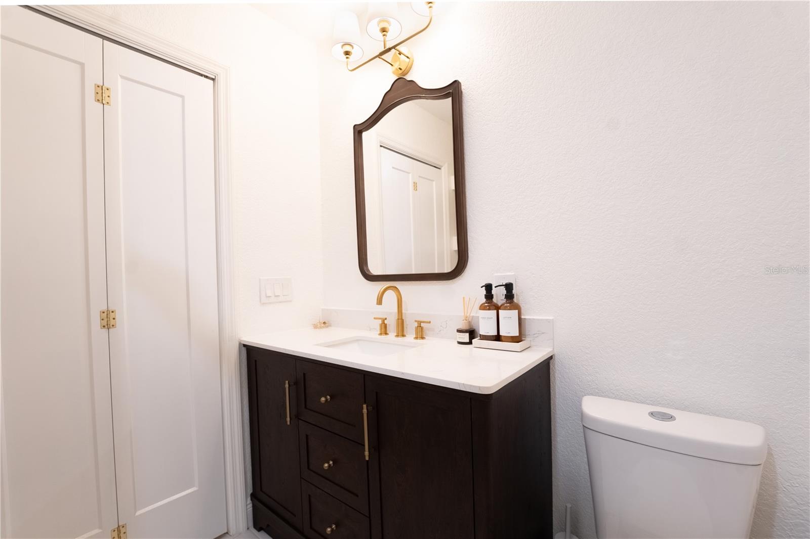 Gorgeous updated primary bathroom with wooden bathroom vanity