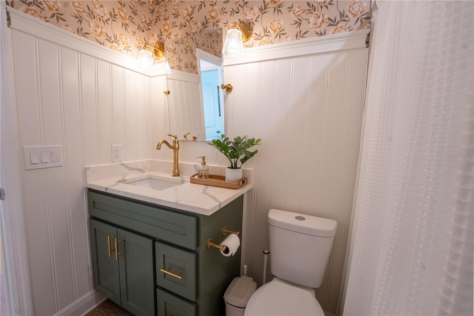 Bathroom 2 - updated bathroom with gold hardware and faucets
