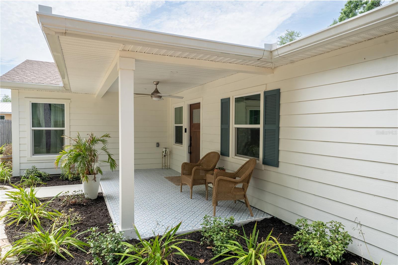 Front covered porch with fresh landscaping
