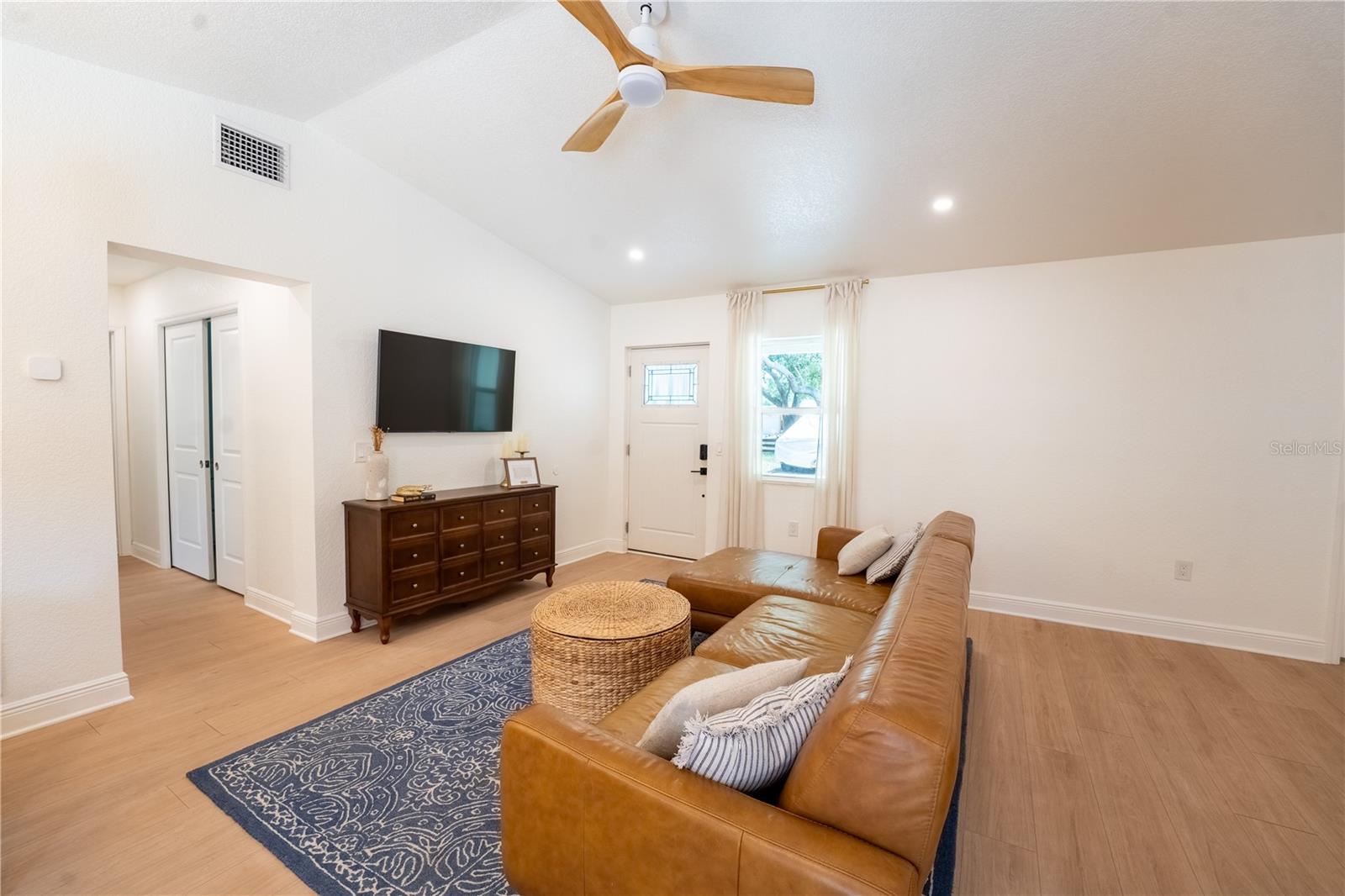 Open concept living room with vaulted ceilings