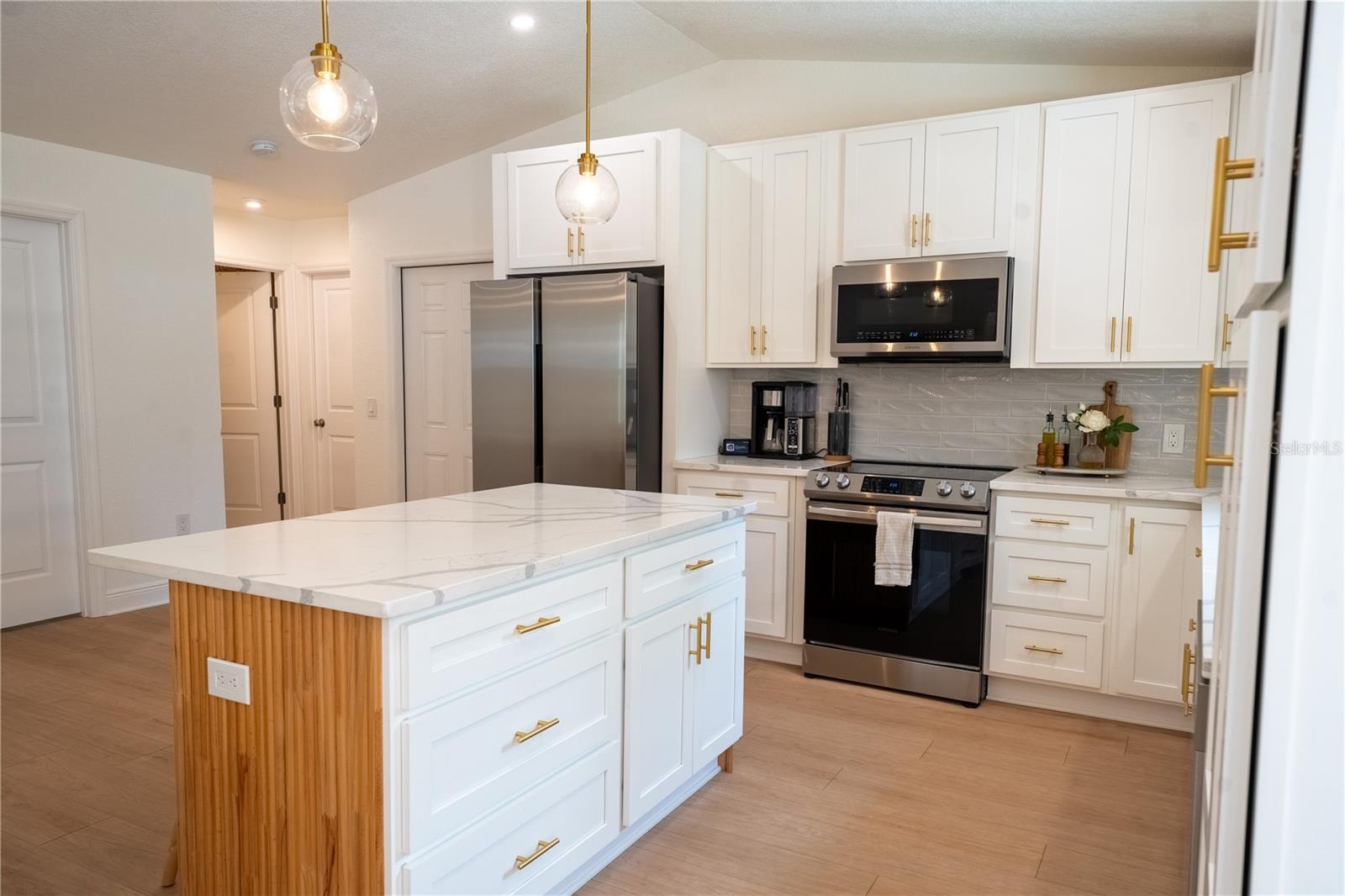 Open concept kitchen with vaulted ceilings