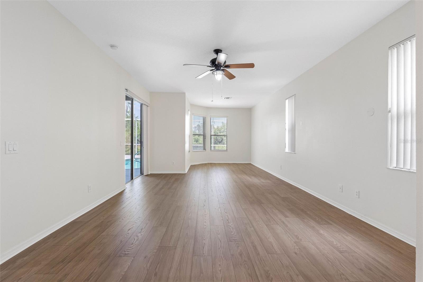 Primary bedroom with sliders to the pool