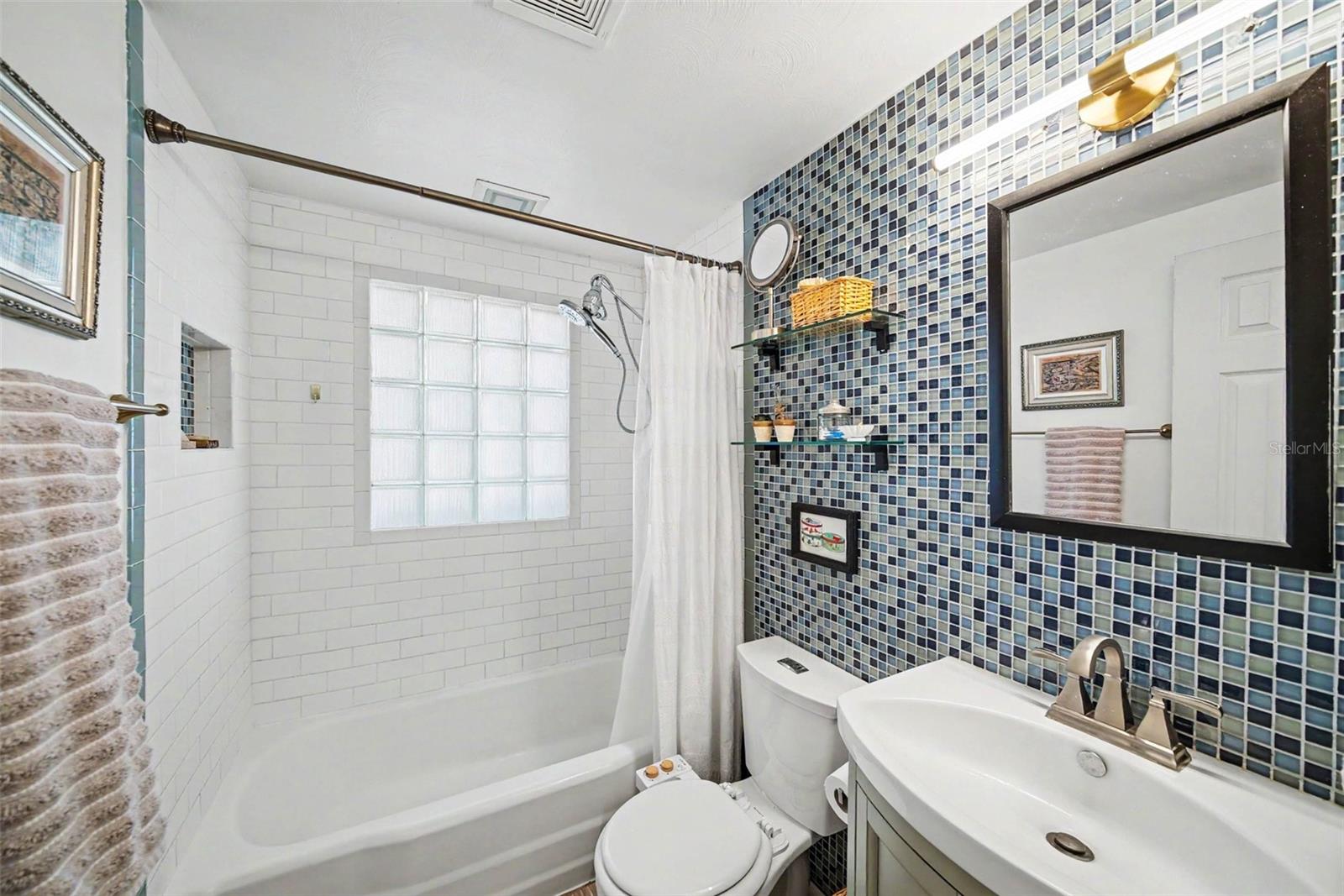 Bathroom with Beautiful Tiled Wall