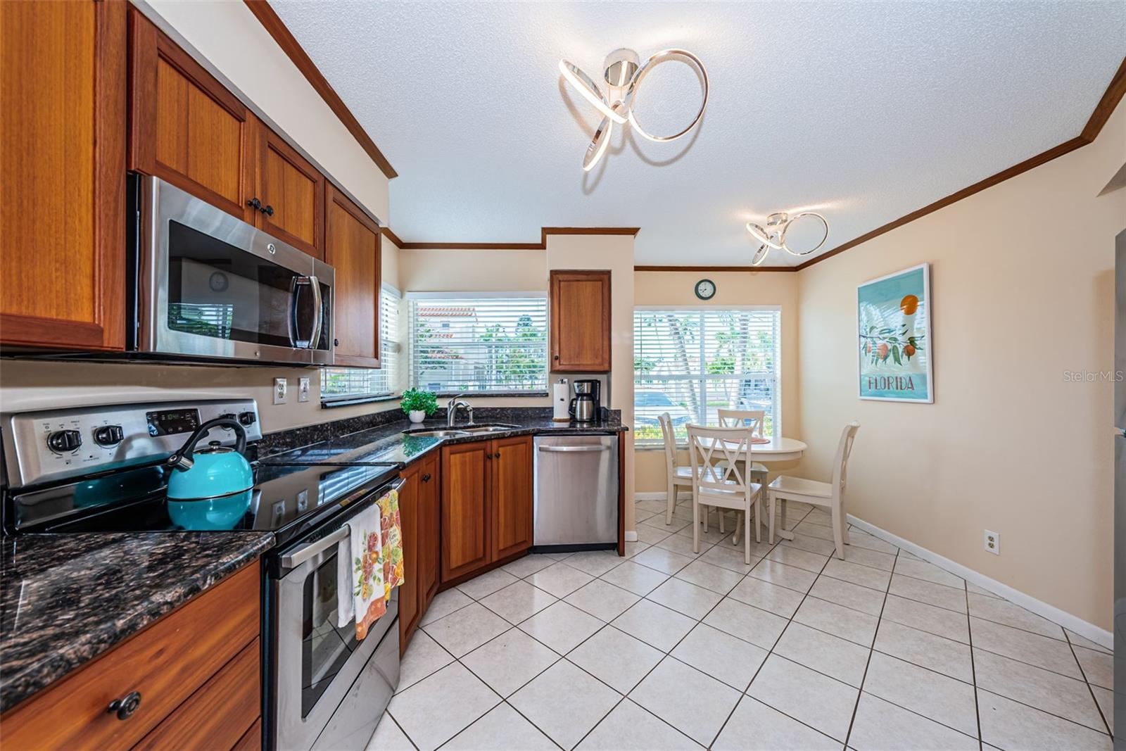 Kitchen with eating space, stainless steel appliances, granite countertops, wood cabinets