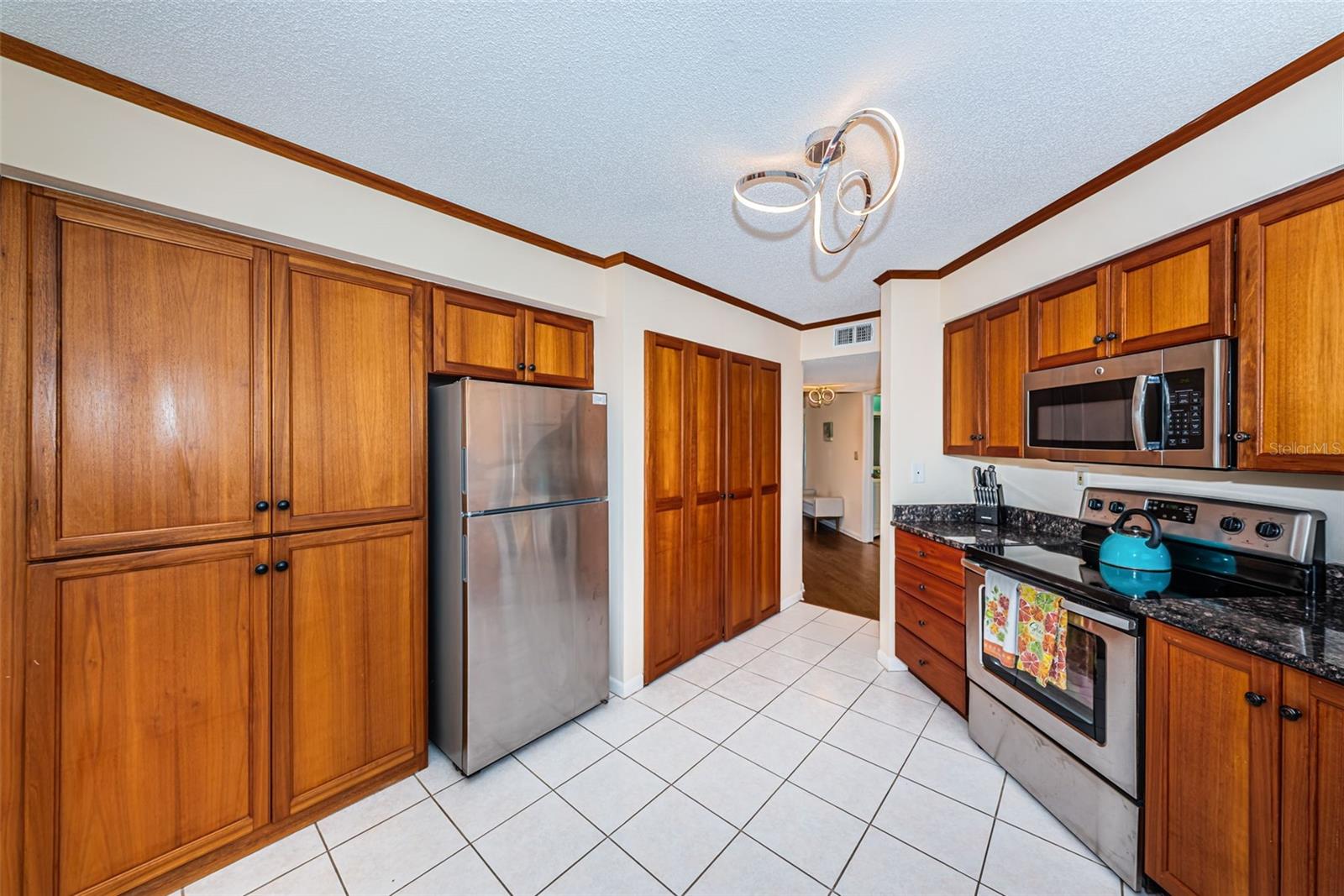Pantry and washer and dryer in kitchen