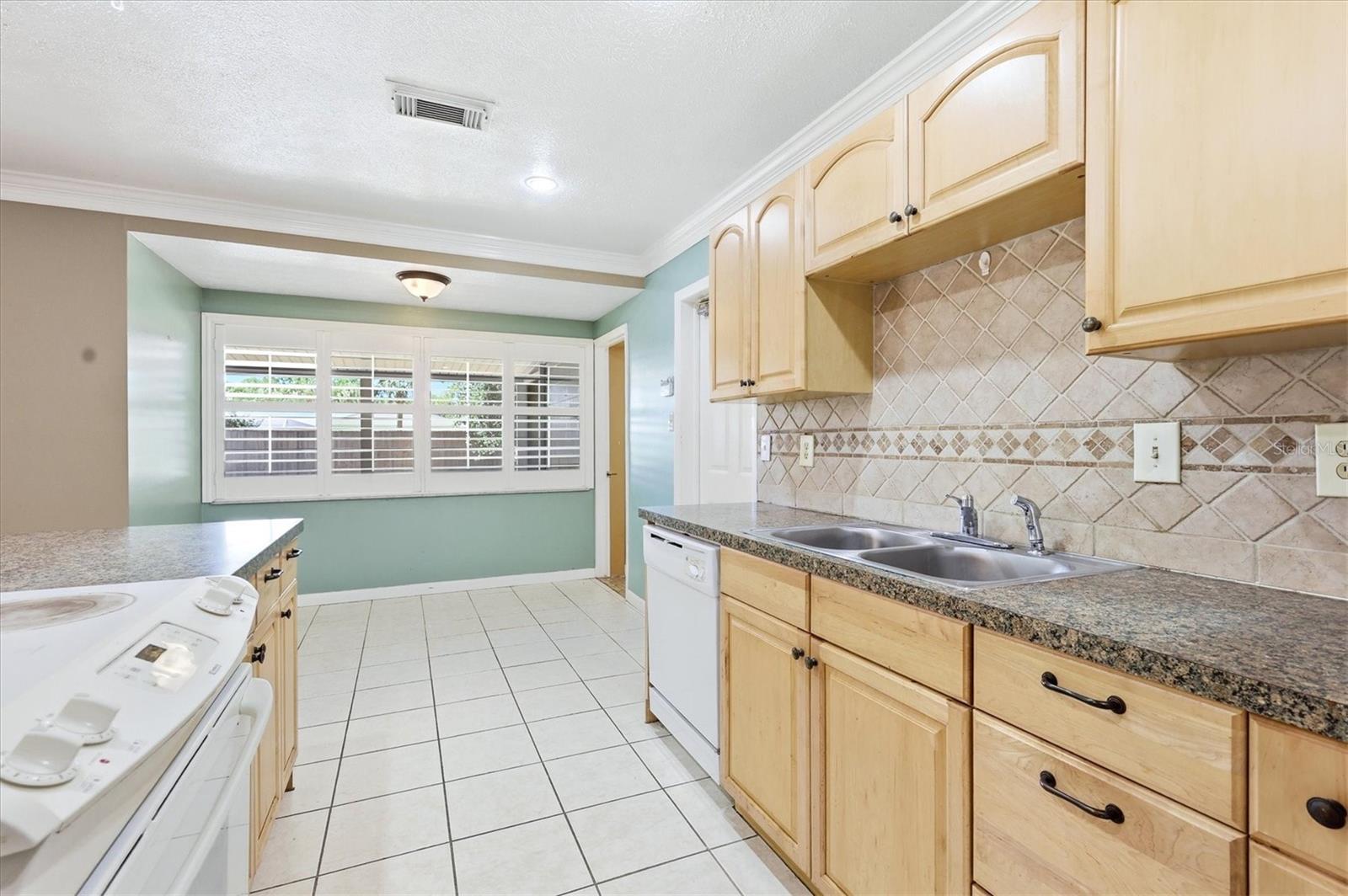 View of kitchen into formal dining room