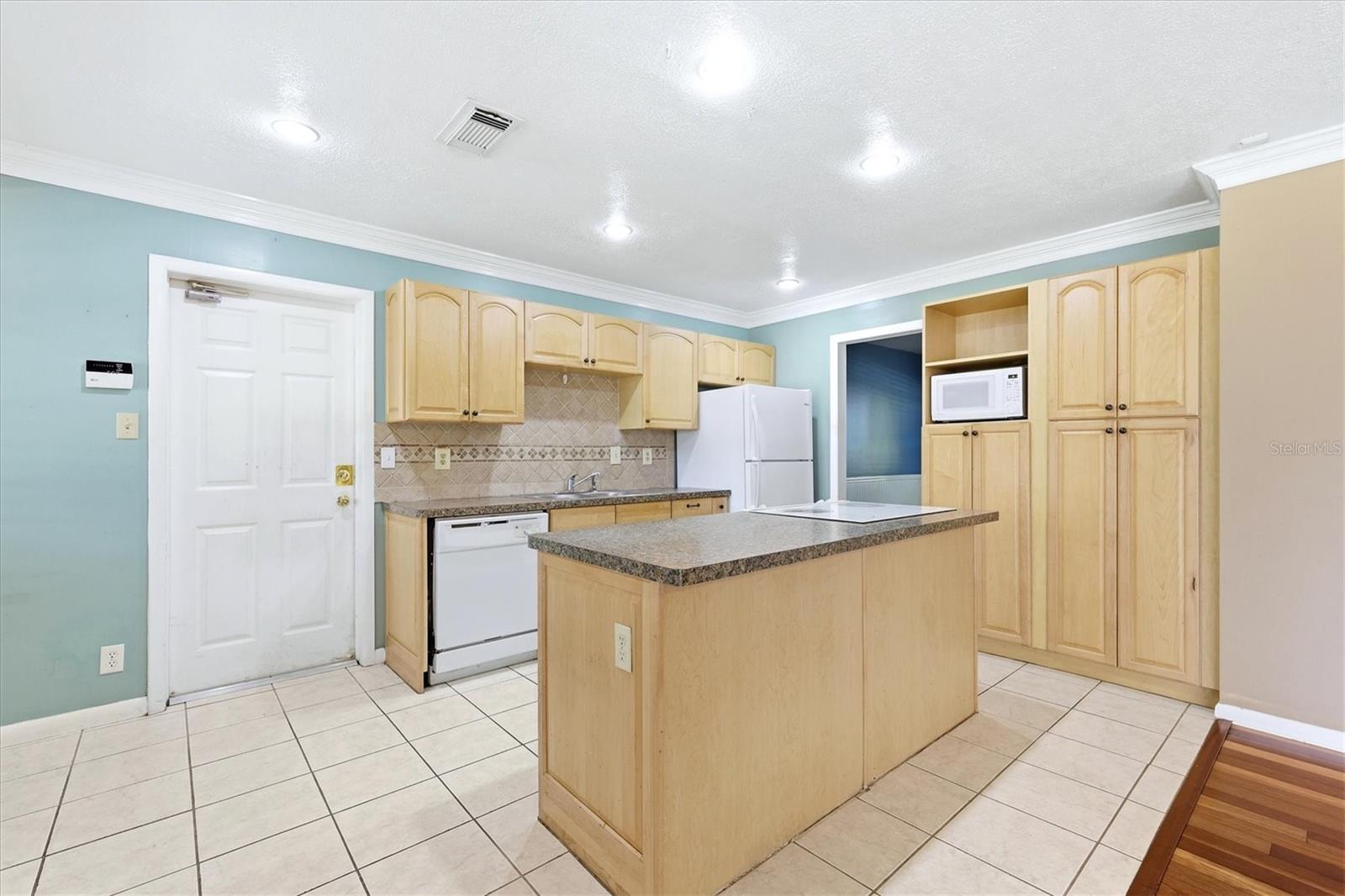 View of kitchen/family room from breakfast nook
