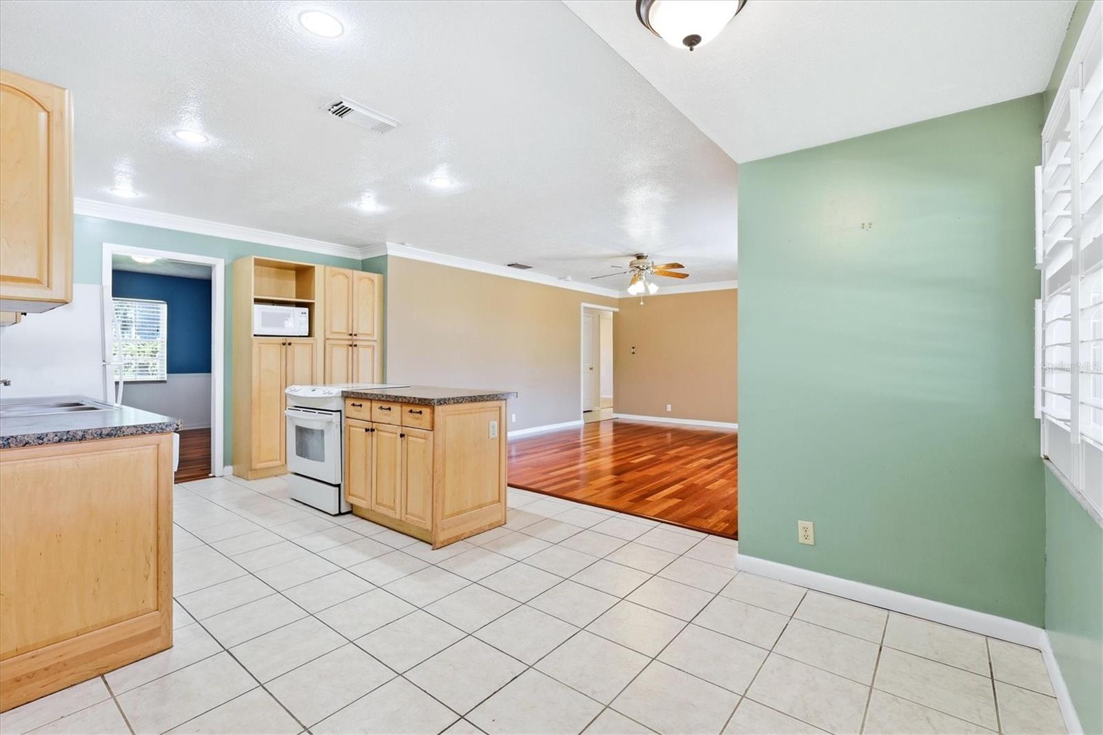 Roomy breakfast nook.  4th bedroom in background.  Garage door in center.