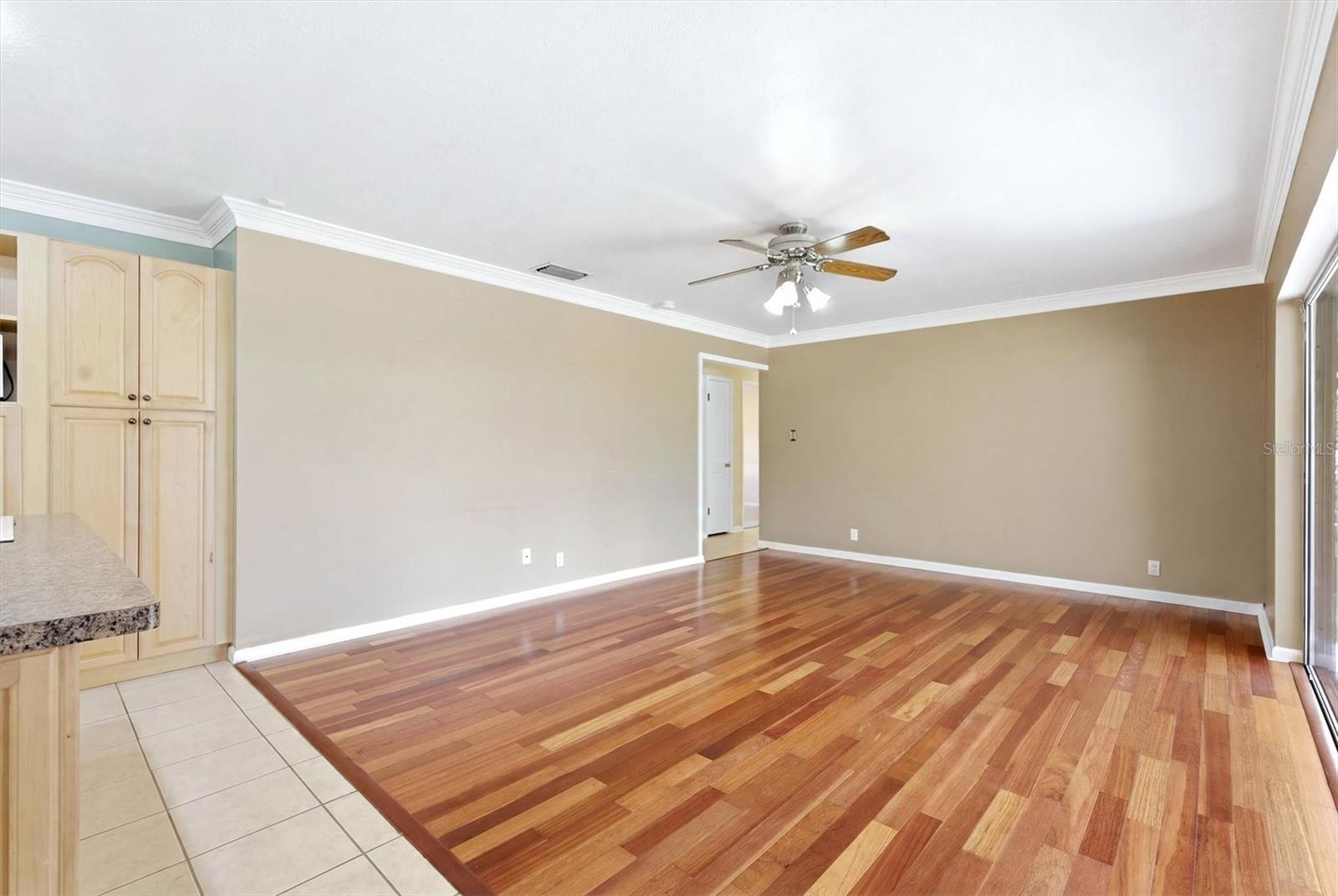 Family room/kitchen combo overlooks back yard.  Breakfast nook and 4th bedroom in background