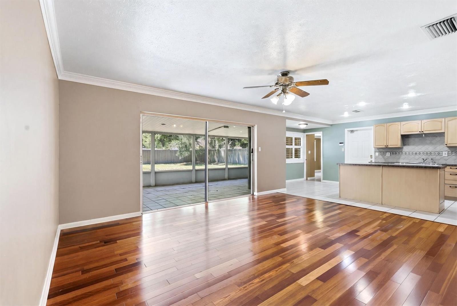 Primary bedroom overlooks backyard and features dual closets