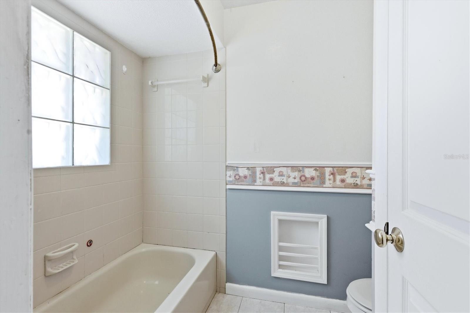 Bathroom 2 offers a lot of storage space with drawers and cabinet as well as a wall cabinet.