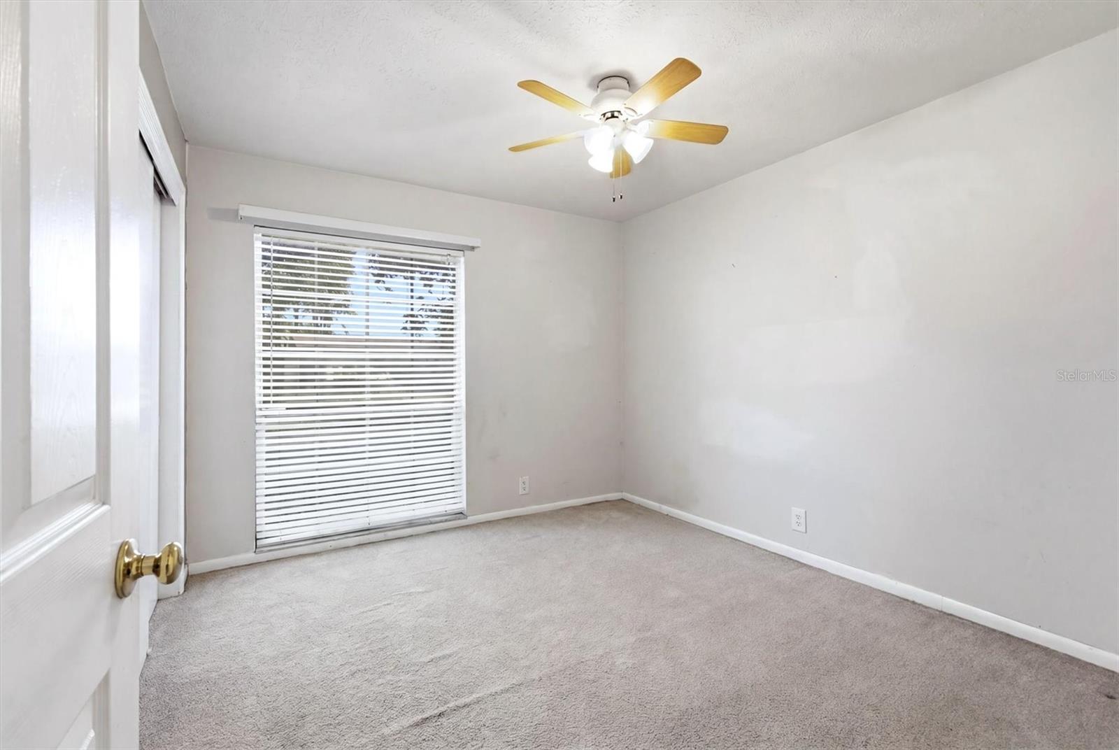 Oversized covered screened patio offers tile flooring.  Previous tree roots lifted a few areas-tree was removed.
