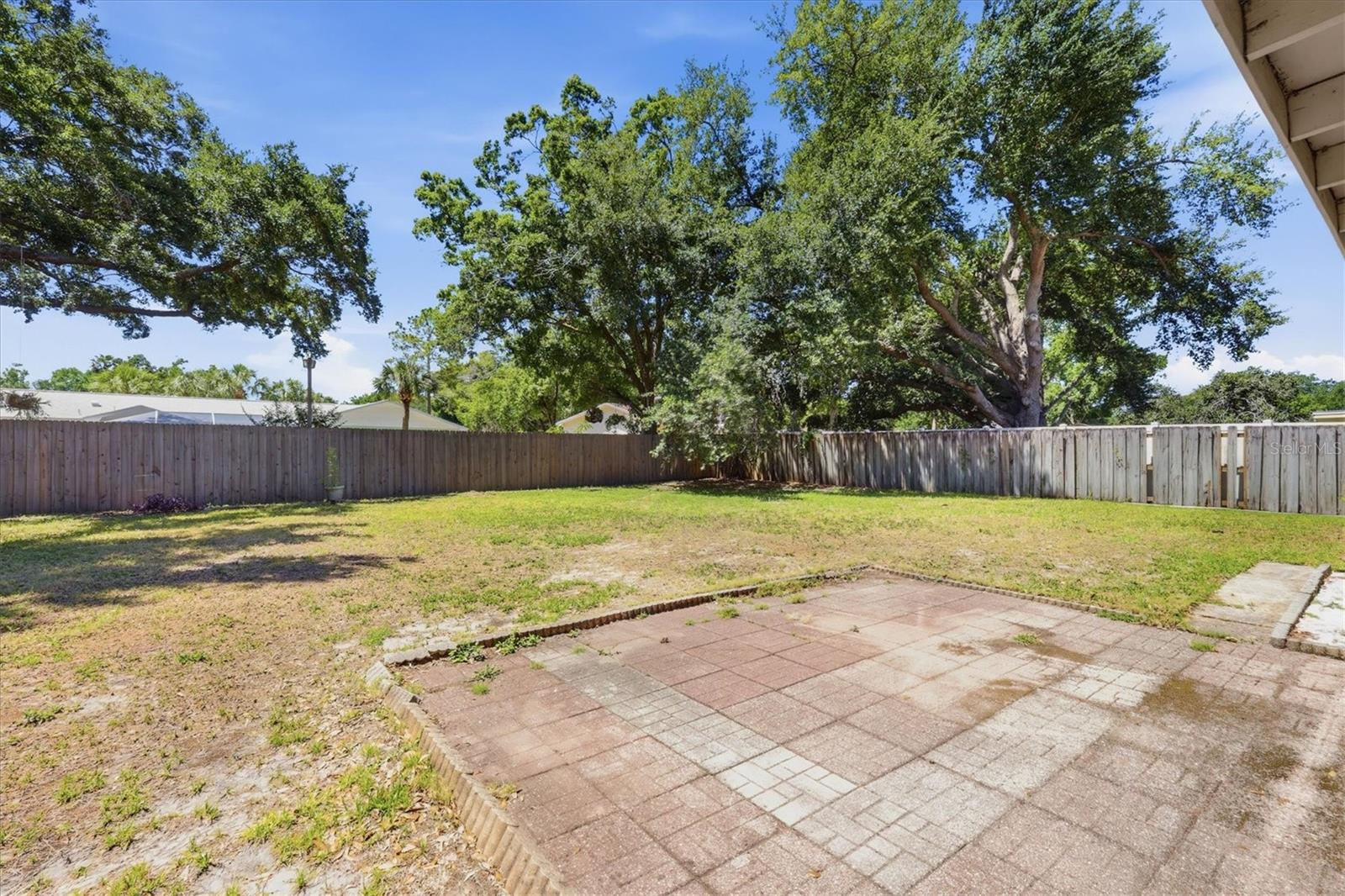 Two storage sheds in the back yard offer space to keep toys, gardening tools, lawn equipment and more