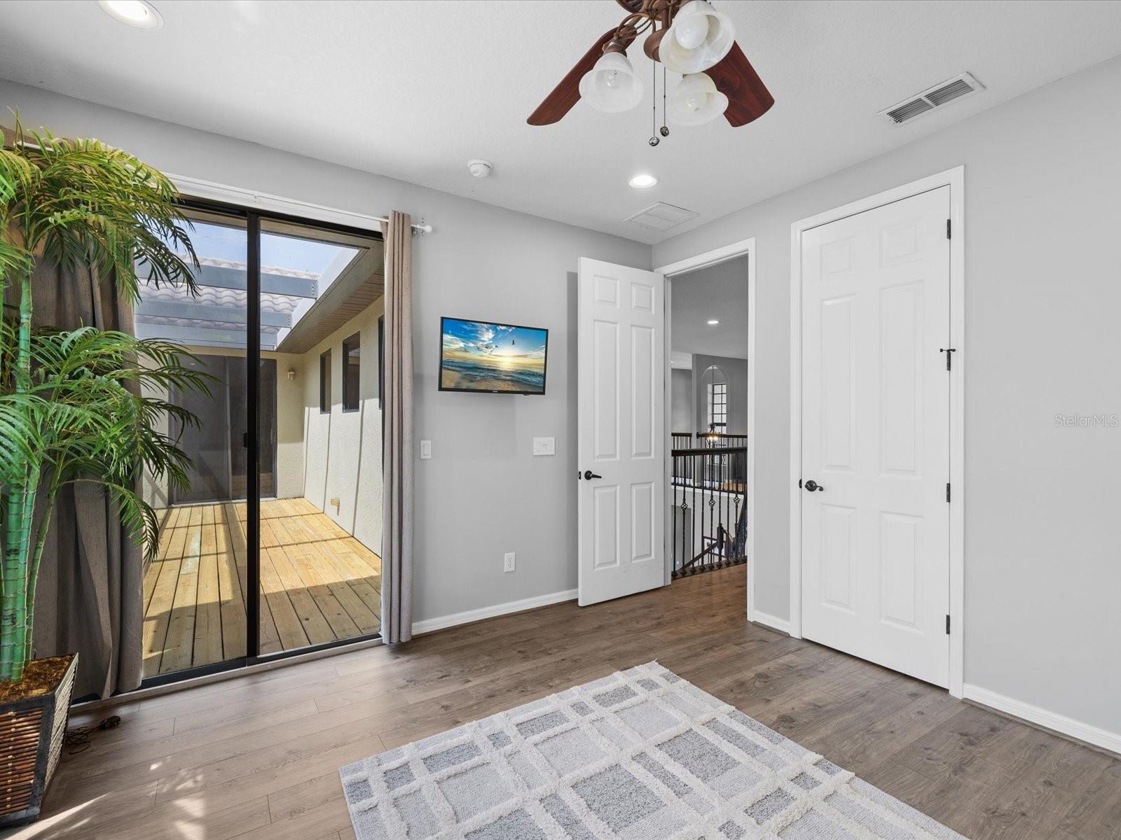 4th bedroom with sliders to balcony