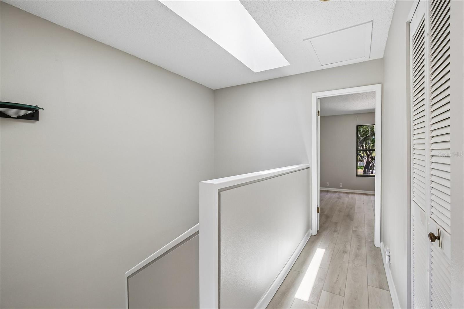 STAIRS AND HALL WAY SPLIT THE BEDROOMS FOR ADDED PRIVACY