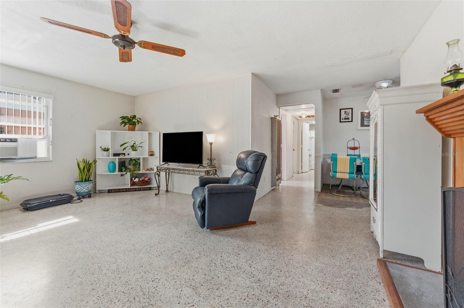 Living room upon entering, terazzo floors