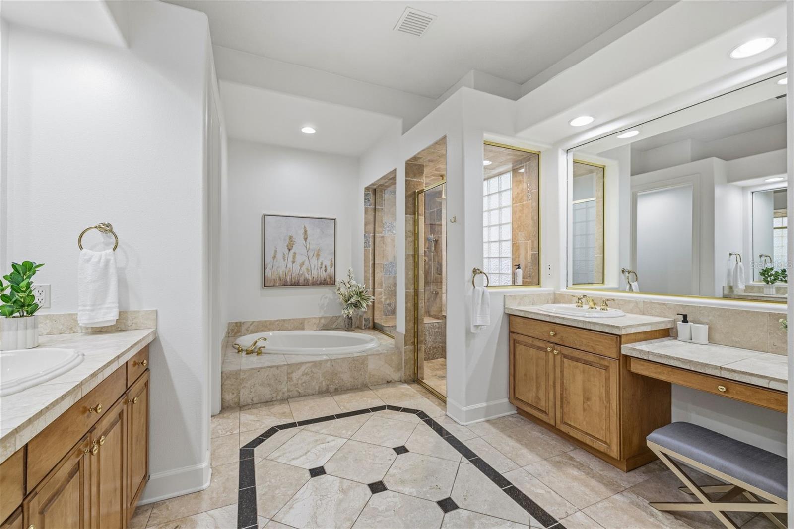Primary Bathroom w/ Soaker Tub + Shower + His & hers vanities