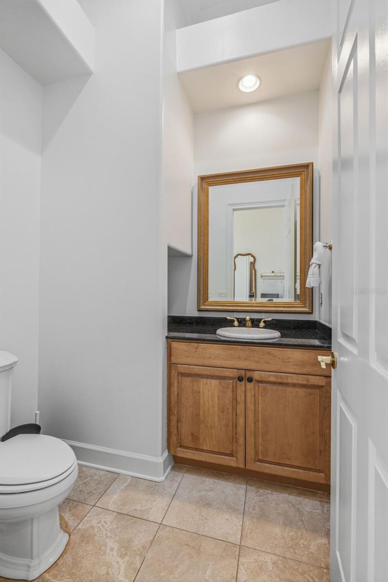 Powder Room adjacent to Formal Living & Dining