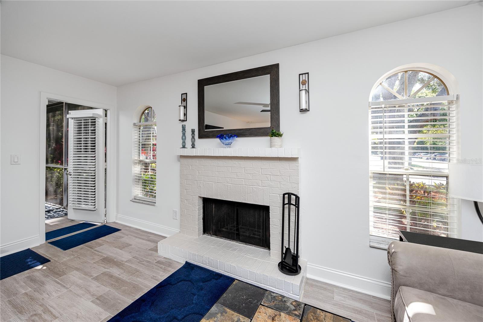 Living Room Fireplace at 2101 Fox Chase Blvd, #107, Palm Harbor, FL 34683