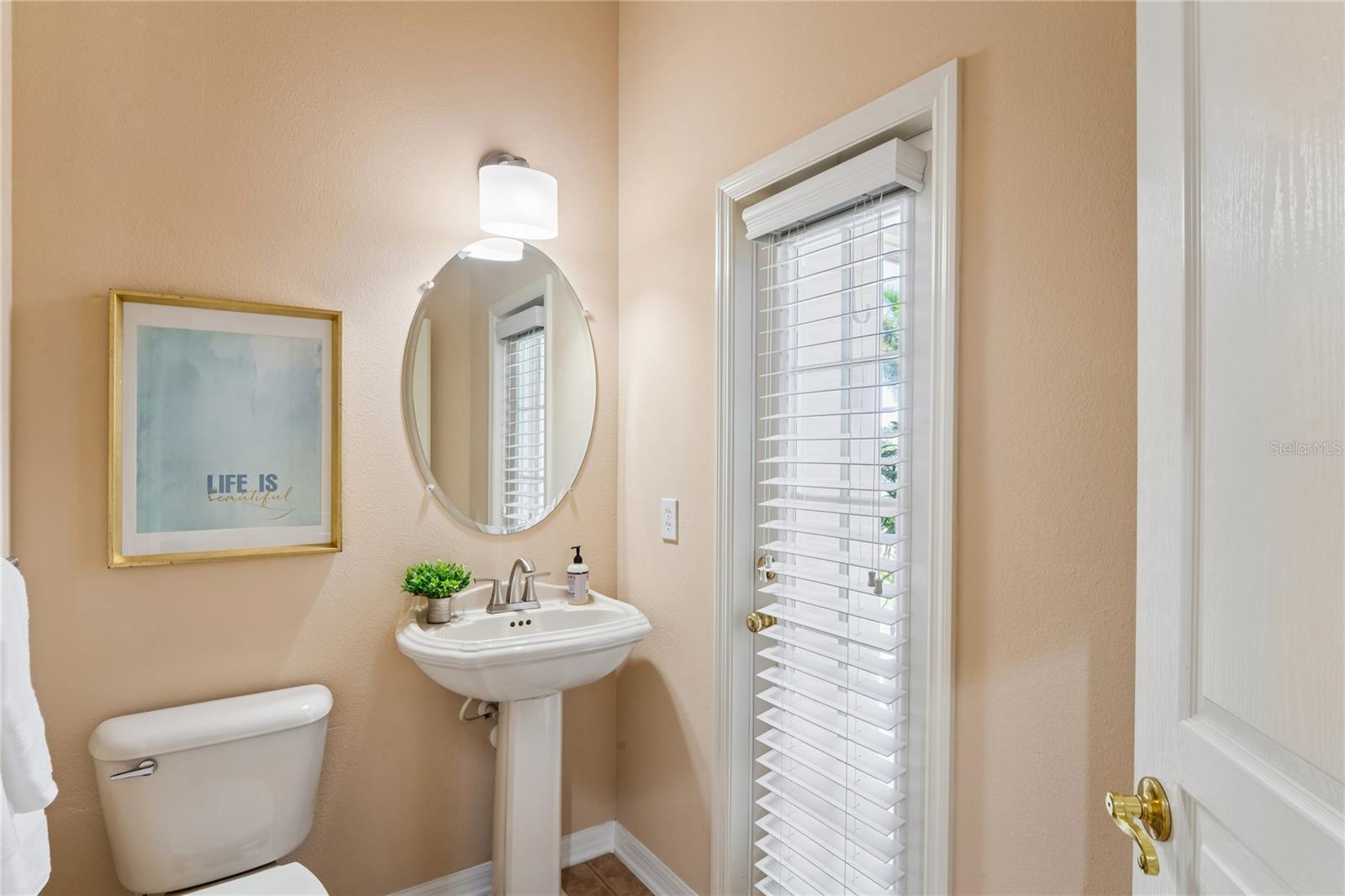 Powder Bath off of lanai and just outside of Primary Bedroom for easy access