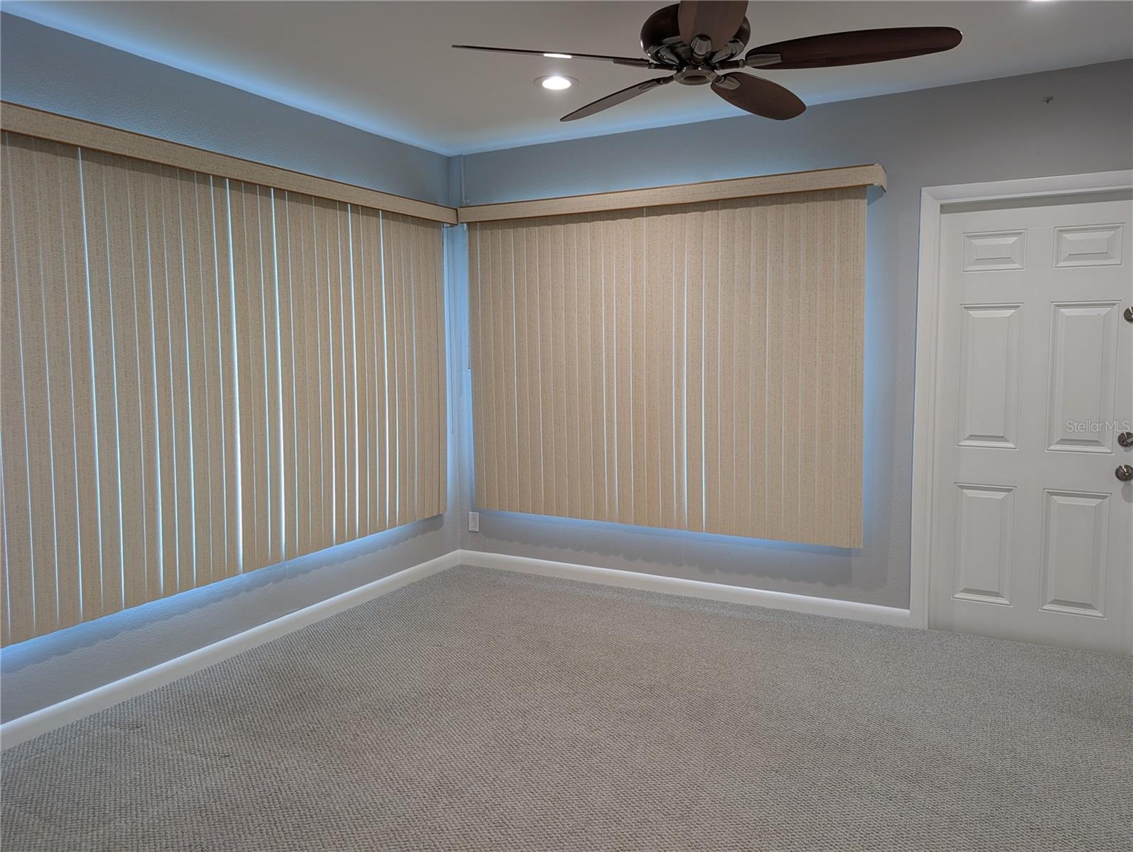 Vacant bonus room. View of interior 6 panel door to side yard.