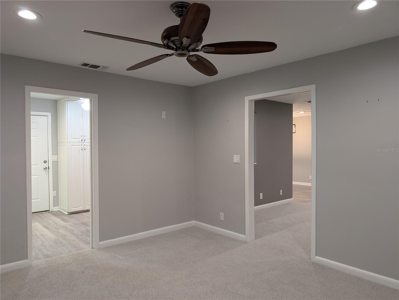 View from bonus room to kitchen laundry area and Florida room.
