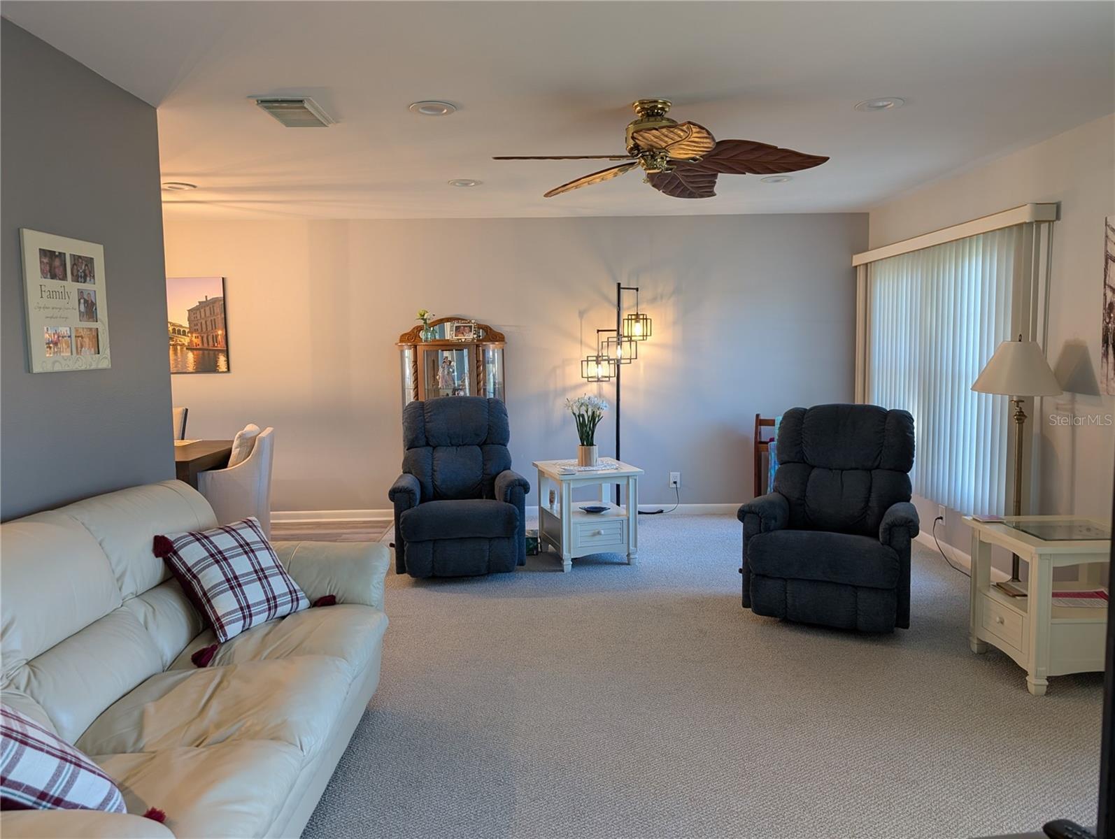 View from bonus room thru the totally updated Family room...new fan, new interior paint and new carpeting.