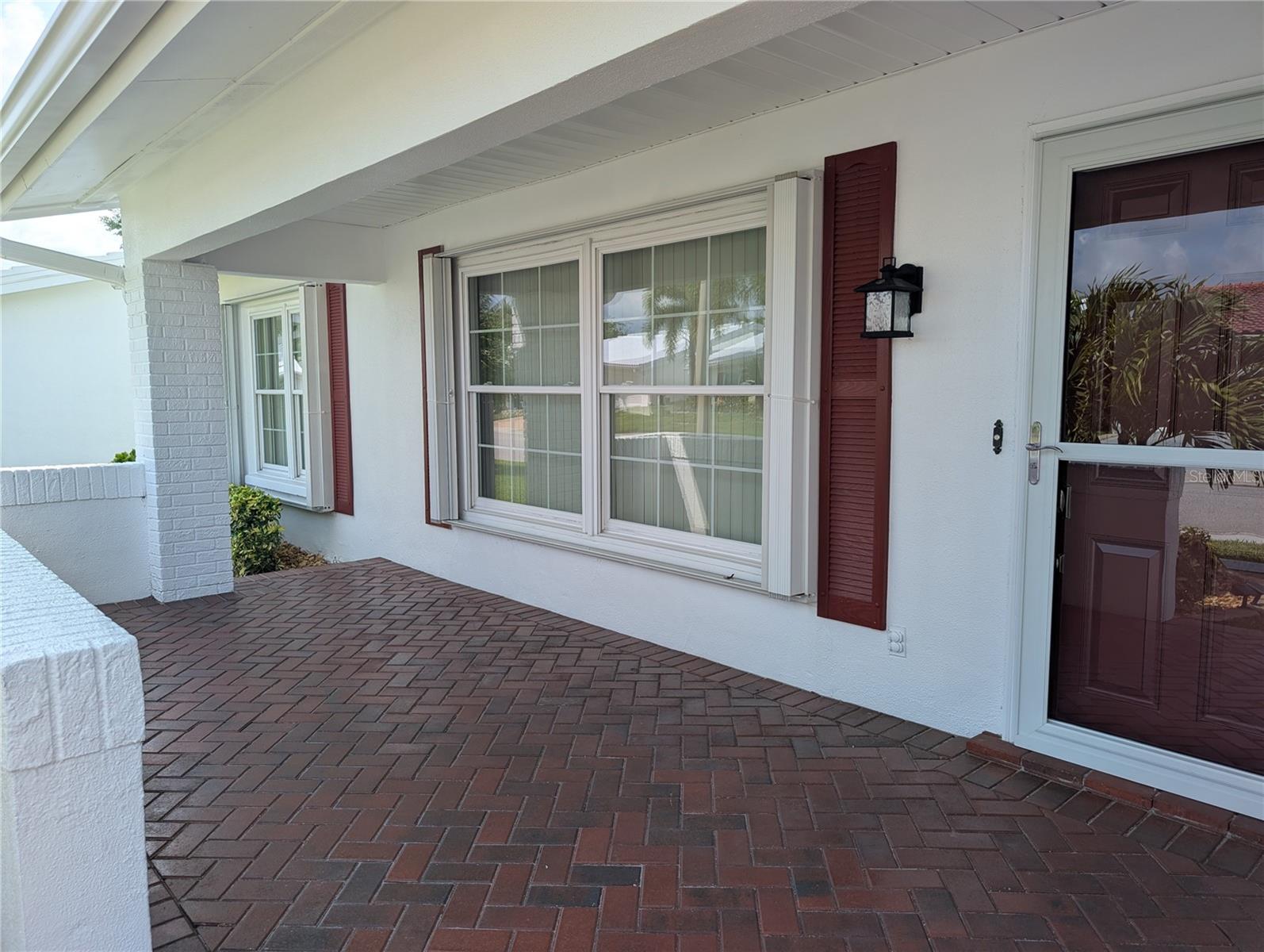Pavered front entry welcomes guests into totally renovated, immaculate home.