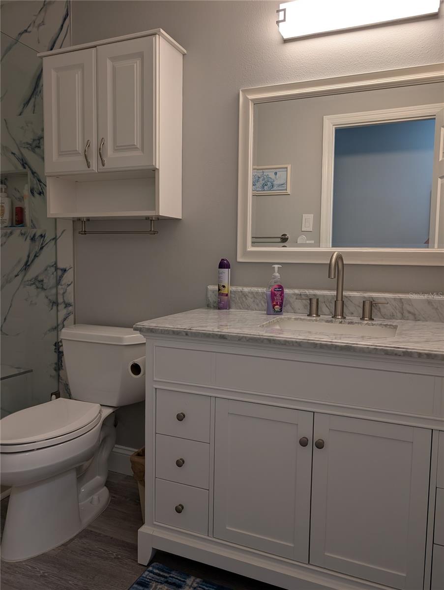 Other updates include luxury vinyl flooring, medicine chest, vanity with marble sinktop, mirror and light.