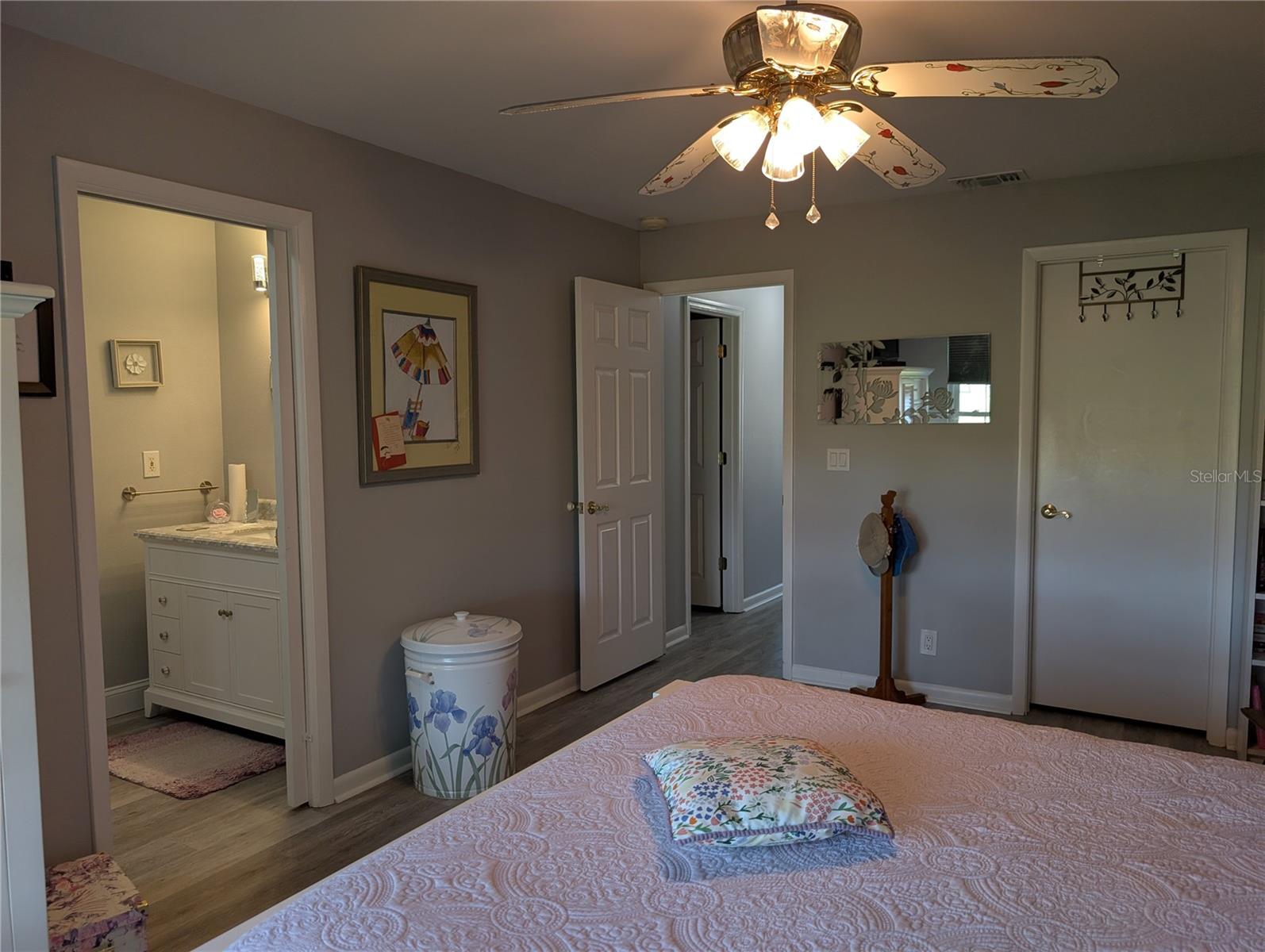 View of Primary Bedroom layout...ensuite bathroom on left, entry to hallway and walk in closet on right.